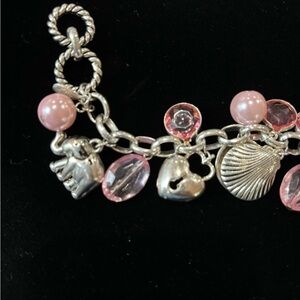 Cookie Lee charm bracelet. 6 silver tone charms with pink/pearl beads and clear